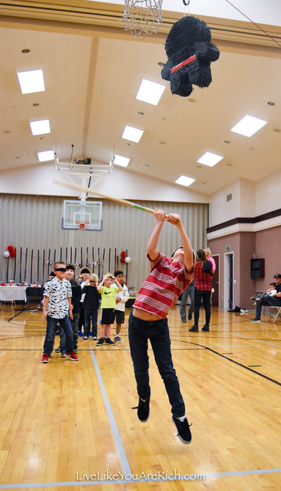 blind folded hitting a ninja pinata