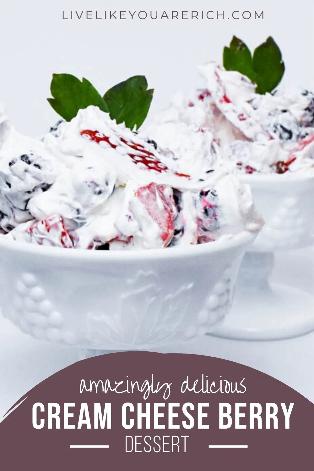This Amazingly Delicious Cream Cheese Berry Dessert is made of fresh fruit further sweetened with pure vanilla extract, powdered sugar, and cool whip. To balance out the sweet, the cream cheese gives the dessert a delicious depth of flavor. Top it off with graham cracker crumbs for additional texture and flavor. #berrydessert #dessert 