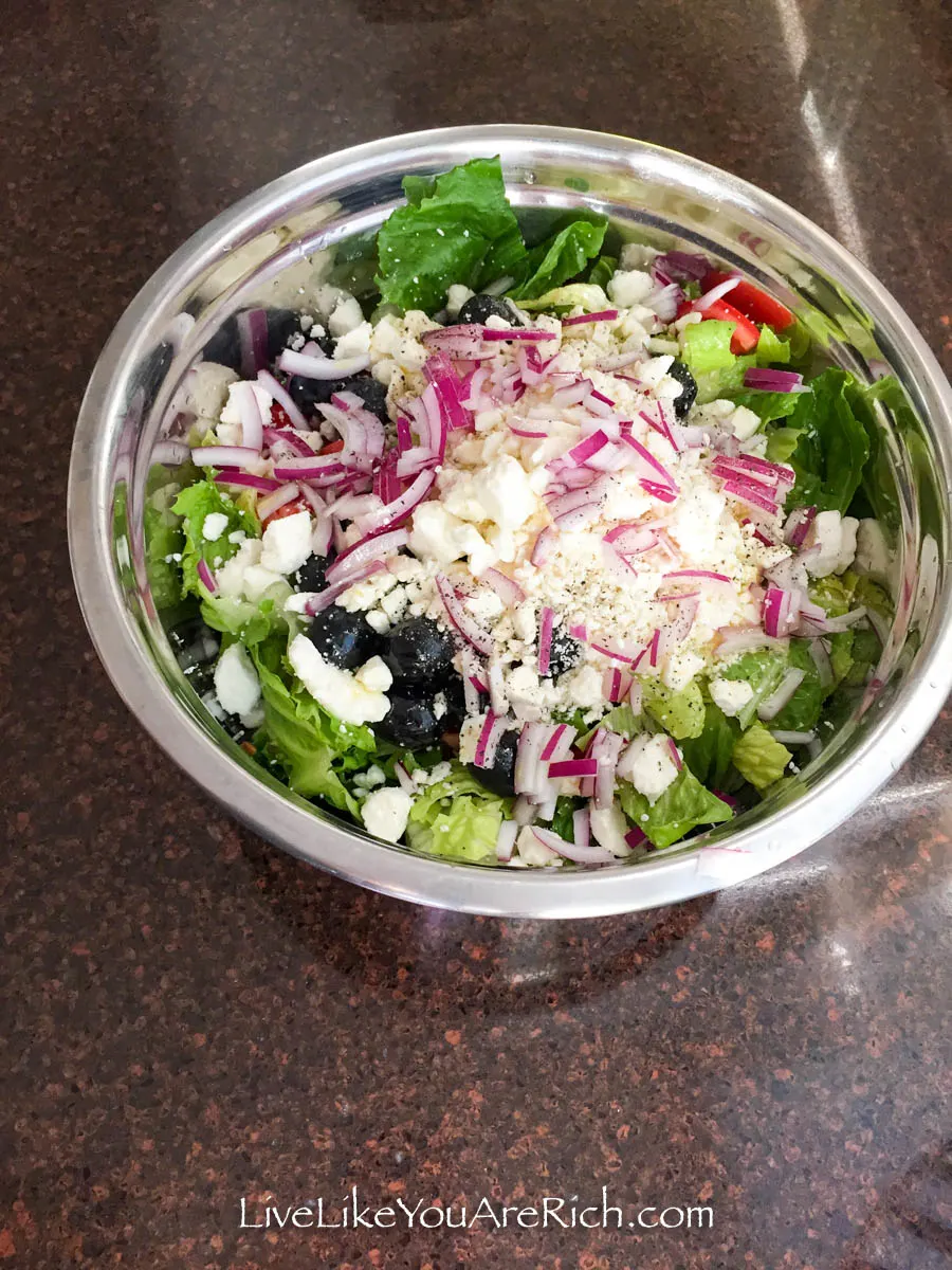 Greek Salad Recipe with all the ingredients in the salad bowl