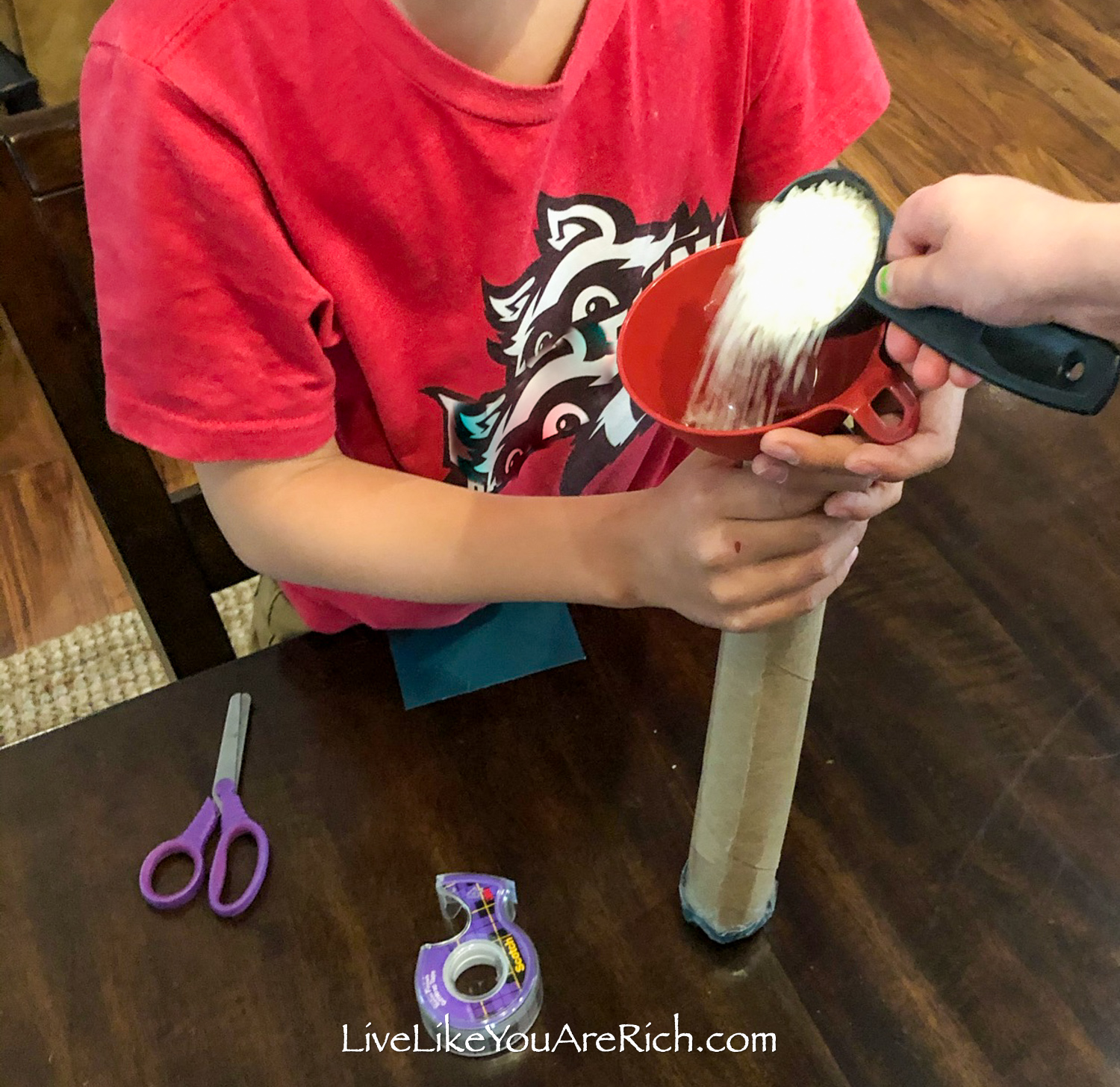 Rainstick filling rice using funnel