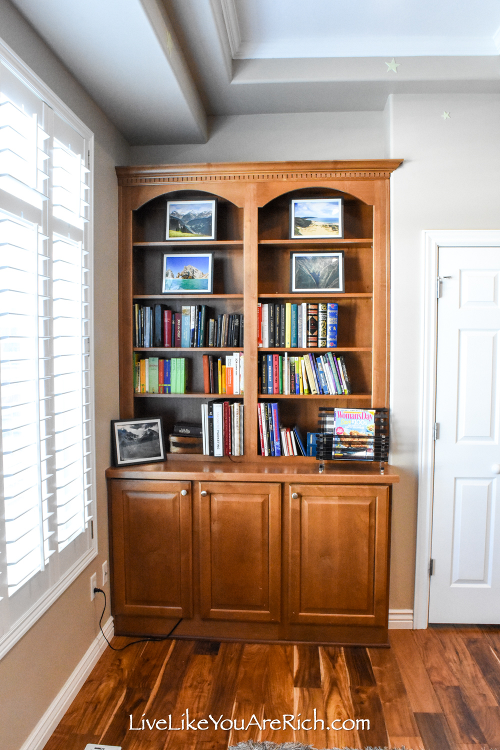 Dollar quality framed landscape photographs on display cabinet