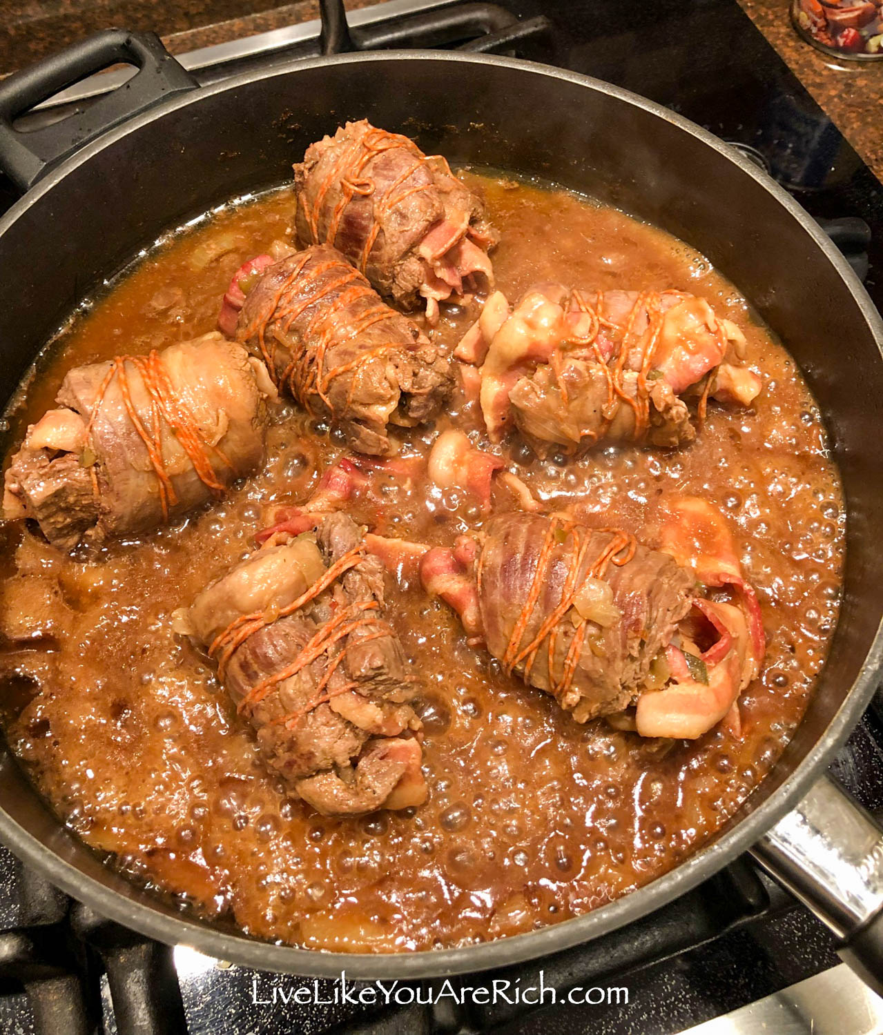Authentic German rouladen and gravy in the skillet