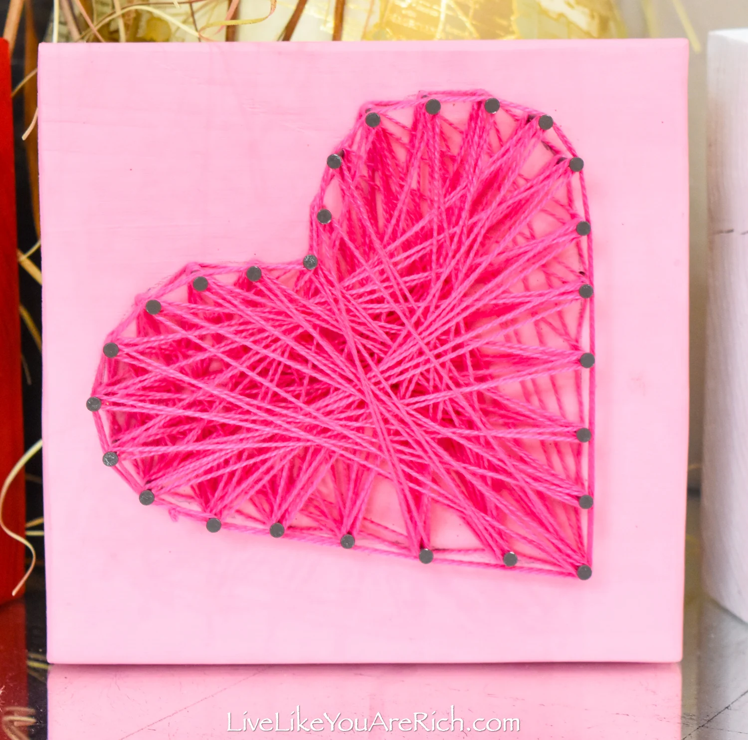 Valentine's String Heart Craft in pink block wood