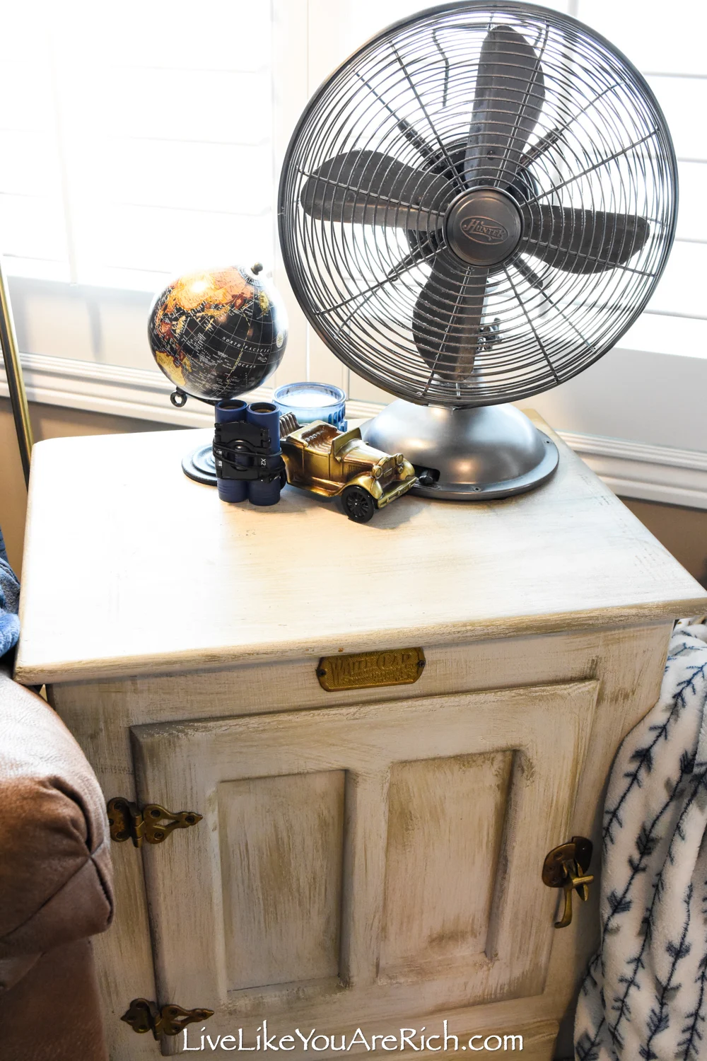 Travel Themed Boy Nursery side table with vintage fan