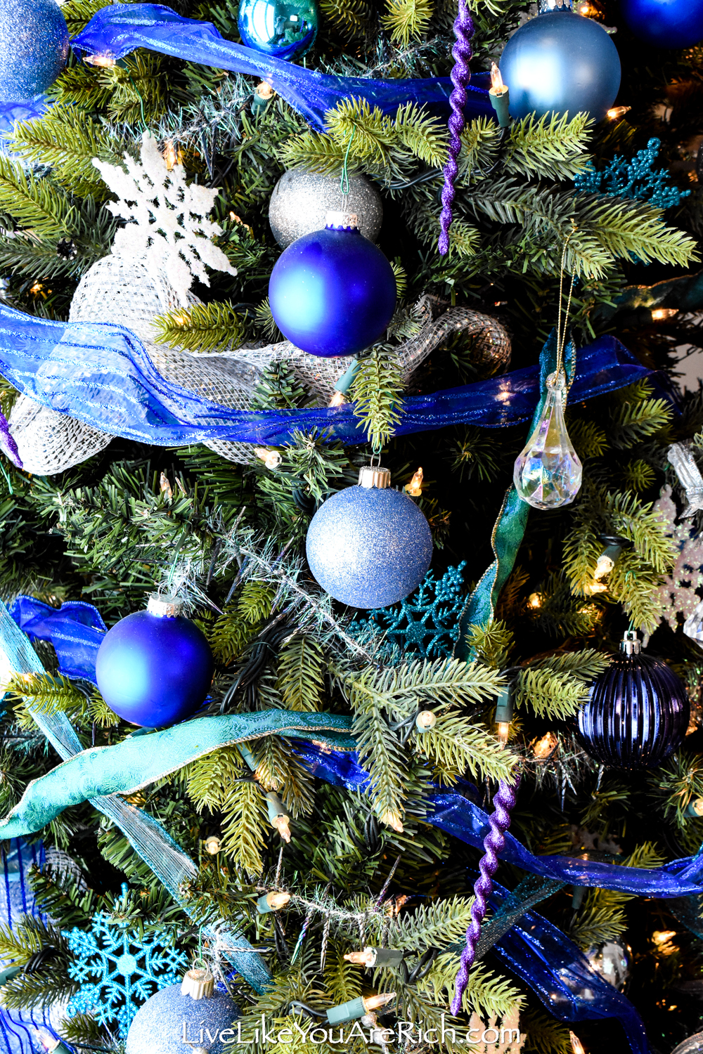 Blue and silver christmas ornaments on dark blue xmas background