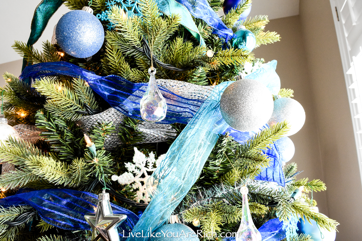 white christmas tree with blue lights