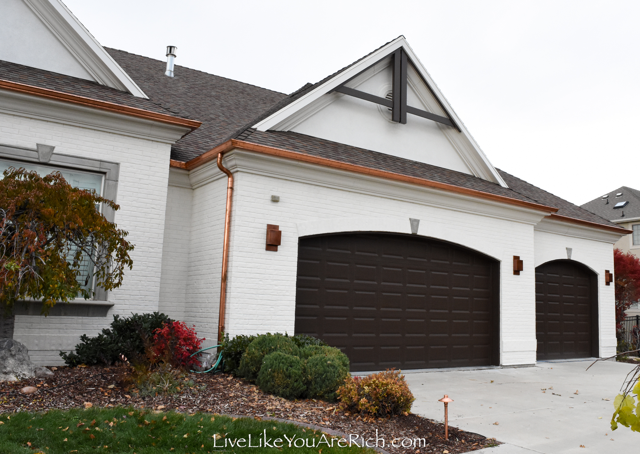 gray house brown garage door