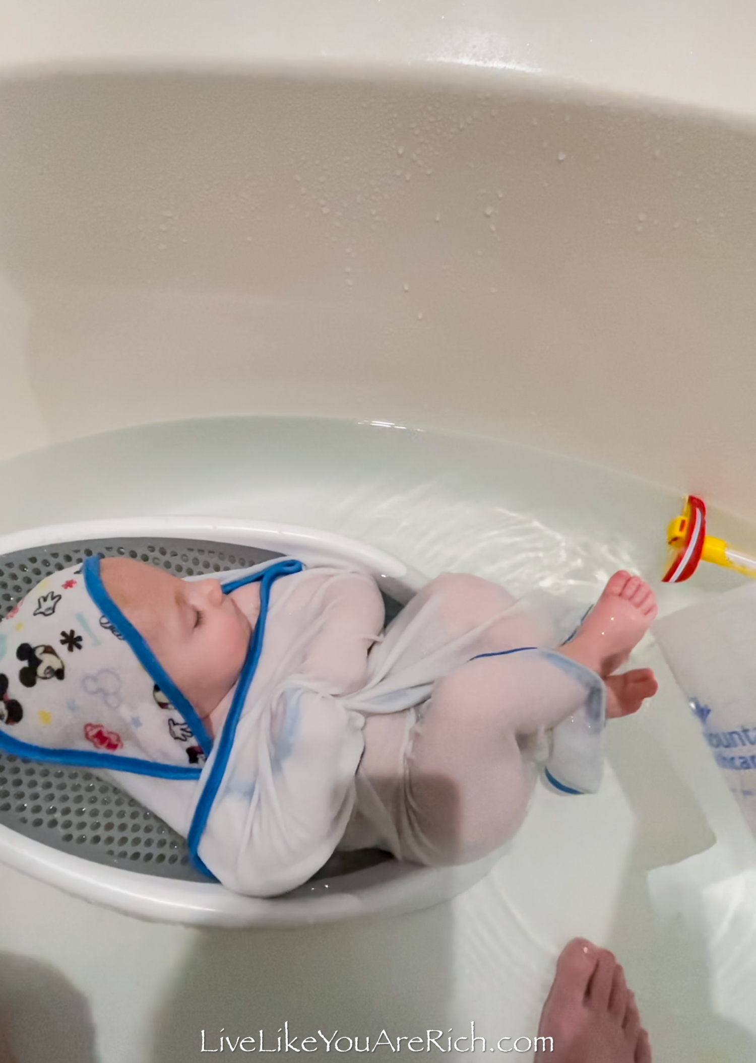 https://livelikeyouarerich.com/wp-content/uploads/2023/09/baby-in-baby-bathtub.jpg
