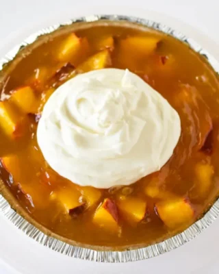 Aunt Elva’s famous no-bake peach pie: the easiest and most delicious treat you’ll ever make! 🍑🥧 

Find the full recipe here 👇👇👇 

http://livelikeyouarerich.com/aunt-elvas-famous-no-bake-peach-pie/